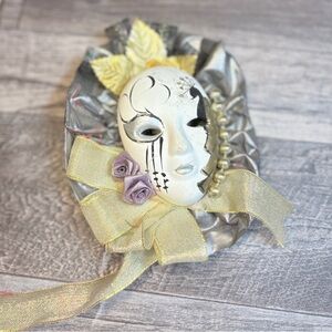 Decorative White and Silver Mask with Gold Accents